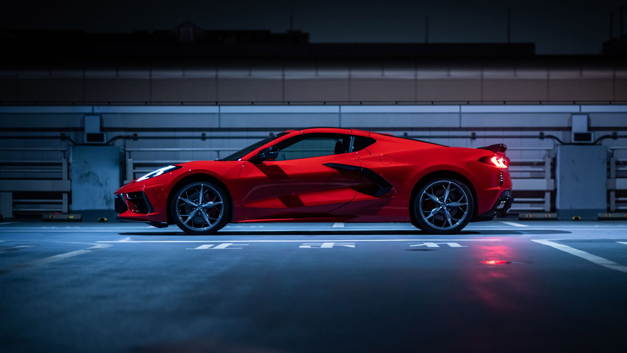 Red Chevrolet Corvette sports car at night